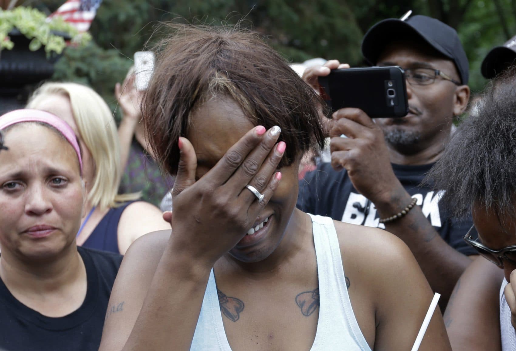 Diamond Reynolds, the girlfriend of Philando Castile, cries outside the governor's residence in St. Paul, Minn., on Thursday, July 7, 2016. Castile was shot and killed after a traffic stop by police in Falcon Heights, Wednesday night. A video shot by Reynolds of the shooting went viral. (Jim Mone/AP)