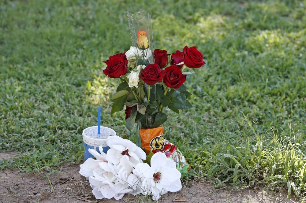 The grave site of Manuel "Manny" Castro Garcia, 19, at a cemetery Thursday, July 14, 2016, in Phoenix. The teen was killed in June, and is one of a growing number of victims associated with a serial killer according to police. (Ross D. Franklin/AP)