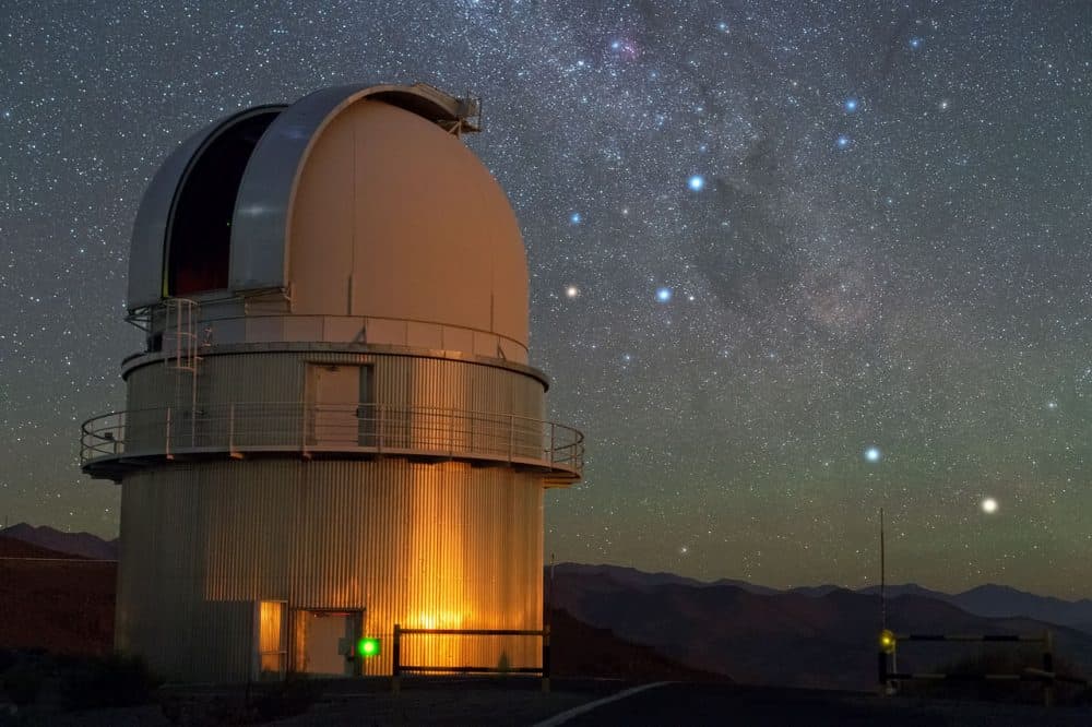 In the sky above ESO's La Silla Observatory, the Southern Cross is visible to the right of the dome of a Danish 1.54-metre telescope. To the lower right of the image, two stars sparkle in the dark sky. From right to left, these are Alpha and Beta Centauri. Alpha Centauri is a multiple star, the nearest star system to Earth. A little closer to Earth than the bright components of Alpha Centauri, and invisible to the naked eye, is Proxima Centauri, the third star belonging to this multiple star system. (European Southern Observatory/Flickr)