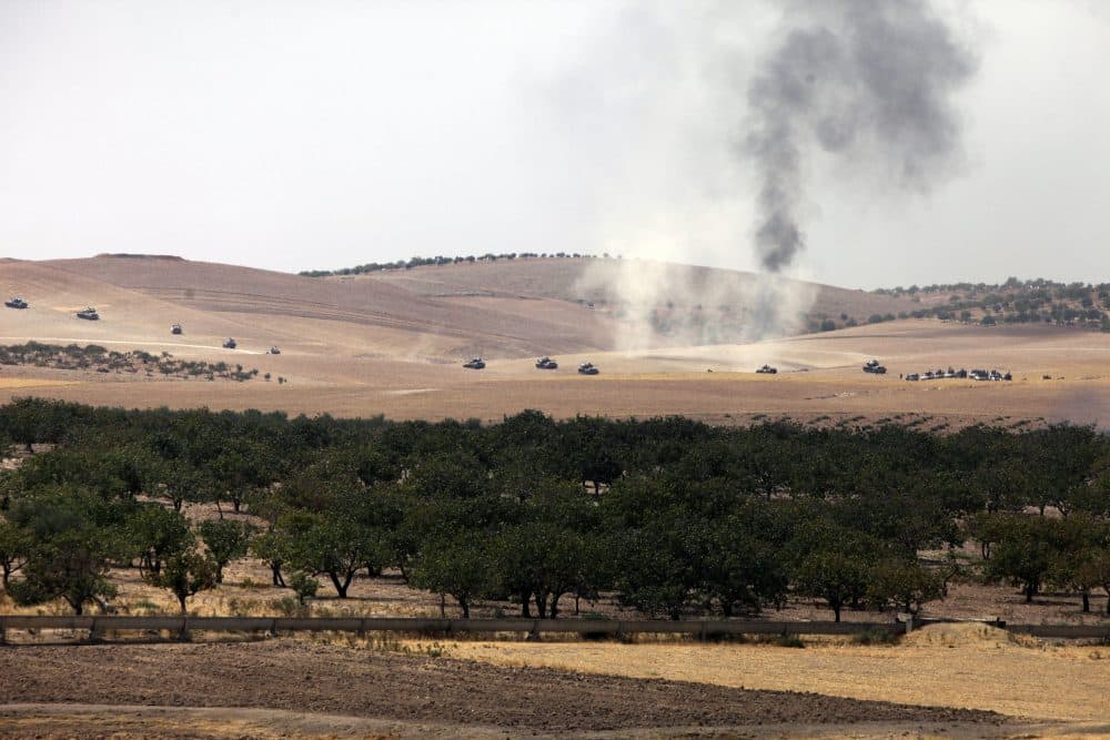 Turkish army tanks move toward the Syrian border as pictured from Karkamis, Turkey, Wednesday, Aug. 24, 2016. (AP)