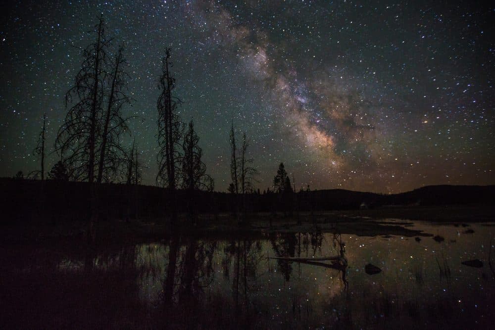 The Milky Way over Firehole Lake Drive in Yellowstone National Park. (Neal Herbert/National Park Service via Flickr)