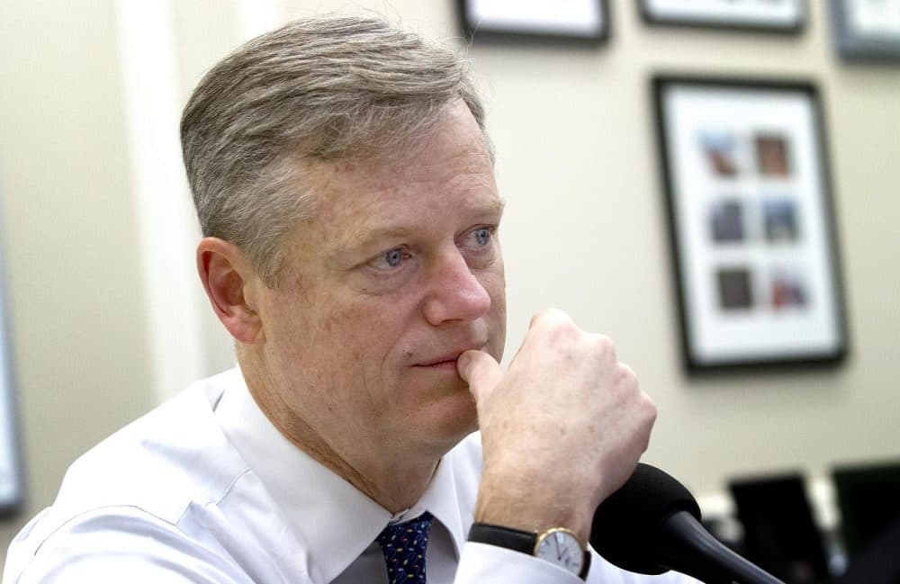 Gov. Charlie Baker, pictured here in his office in 2015, signed a nearly $1 billion economic development bill into law Wednesday. (Robin Lubbock/WBUR)