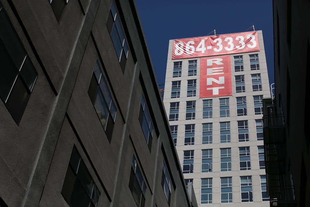 A large "rent" banner is posted on the side of an apartment building on June 15, 2012 in San Francisco, Calif. (Justin Sullivan/Getty Images)