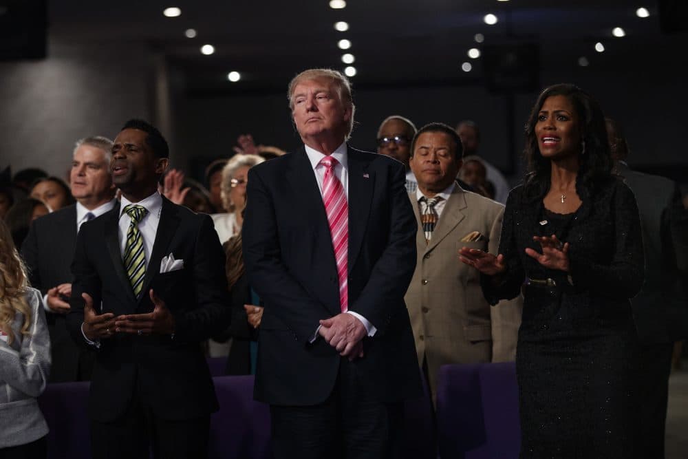Republican presidential candidate Donald Trump, center, looks on during a church service at Great Faith Ministries, Saturday, Sept. 3, 2016, in Detroit. (Evan Vucci/AP)