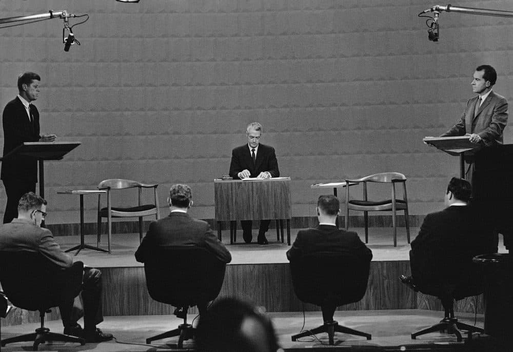 Presidential candidates Sen. John Kennedy, left, and Vice President Richard Nixon face each other in a Chicago television studio during the first-ever televised presidential debate on Sept. 26, 1960. In center is moderator Howard K. Smith. (AP)