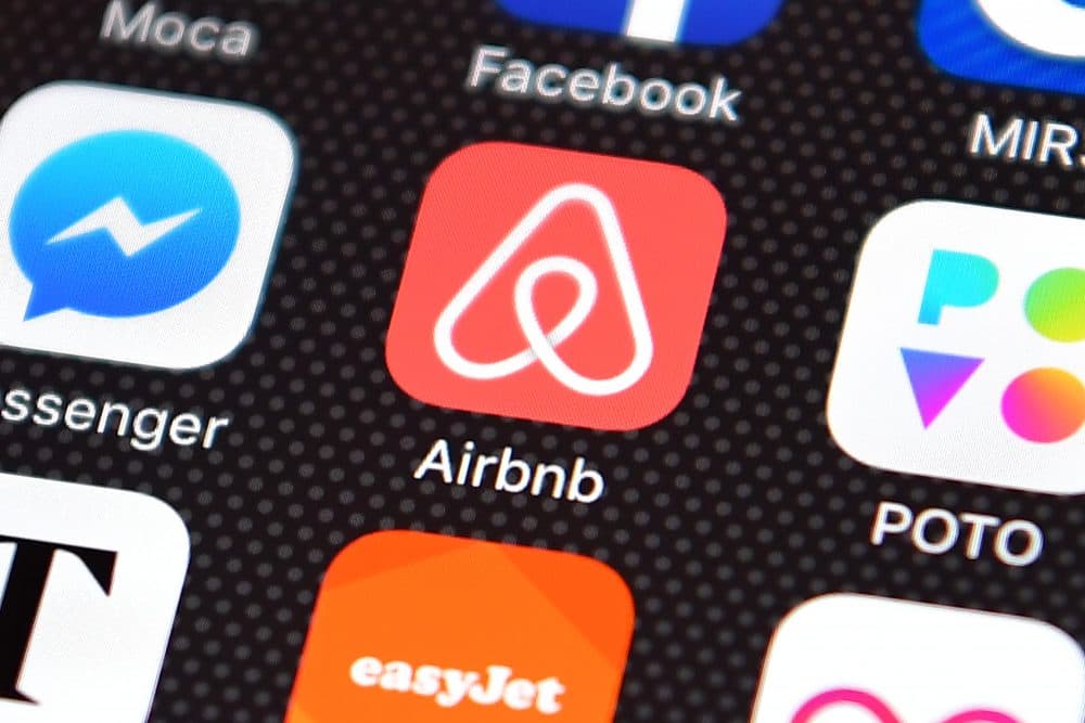 The Airbnb app logo displayed on an iPhone. (Carl Court/Getty Images)