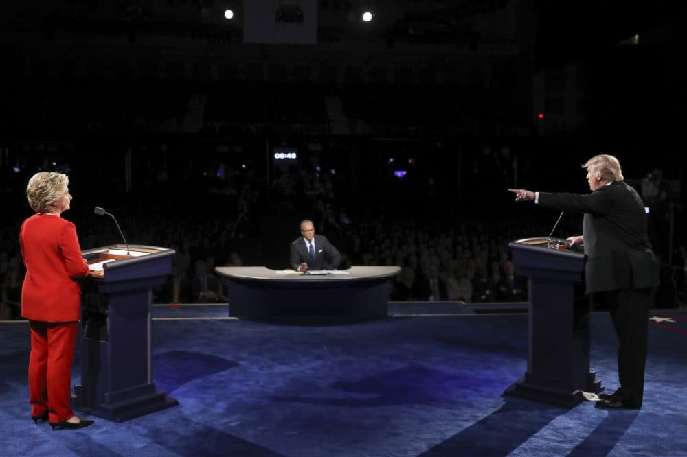 Republican presidential nominee Donald Trump points toward Democratic presidential nominee Hillary Clinton during the presidential debate at Hofstra University in Hempstead, N.Y., Monday, Sept. 26, 2016. (Joe Raedle/Pool via AP)