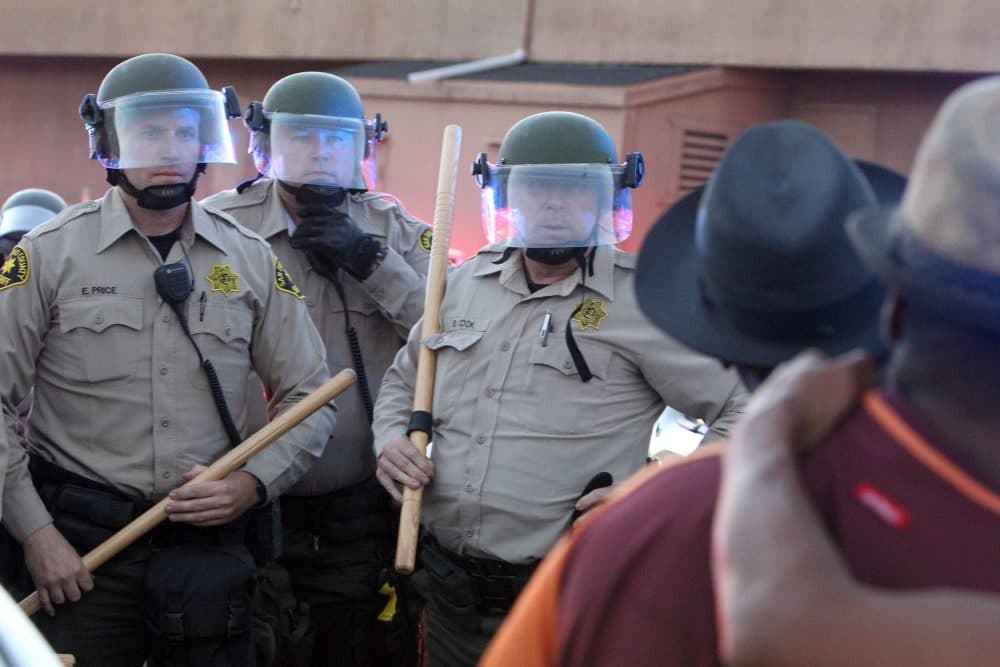 Protesters face off with police during a rally in El Cajon, a suburb of San Diego, Calif. on Sept. 28, 2016. (Bill Wechter/AFP/Getty Images)