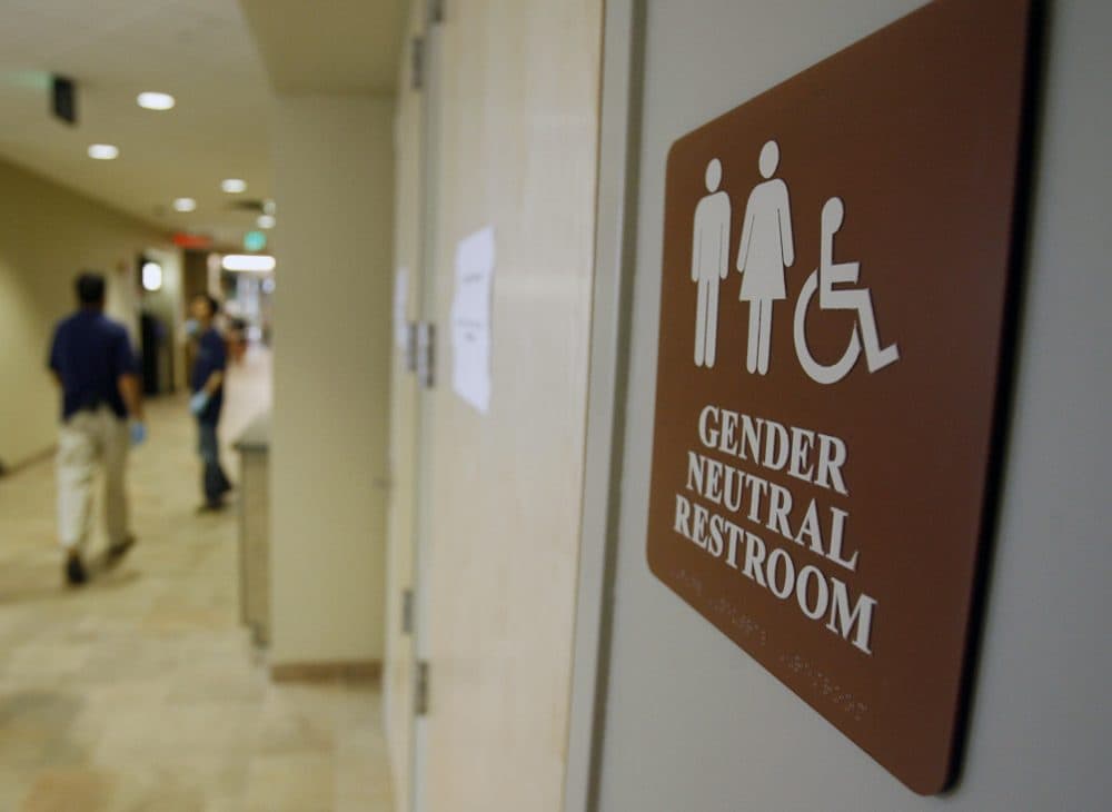 In this Aug. 23, 2007, file photo, a sign marks the entrance to a gender-neutral restroom at the University of Vermont in Burlington. (Toby Talbot/AP)