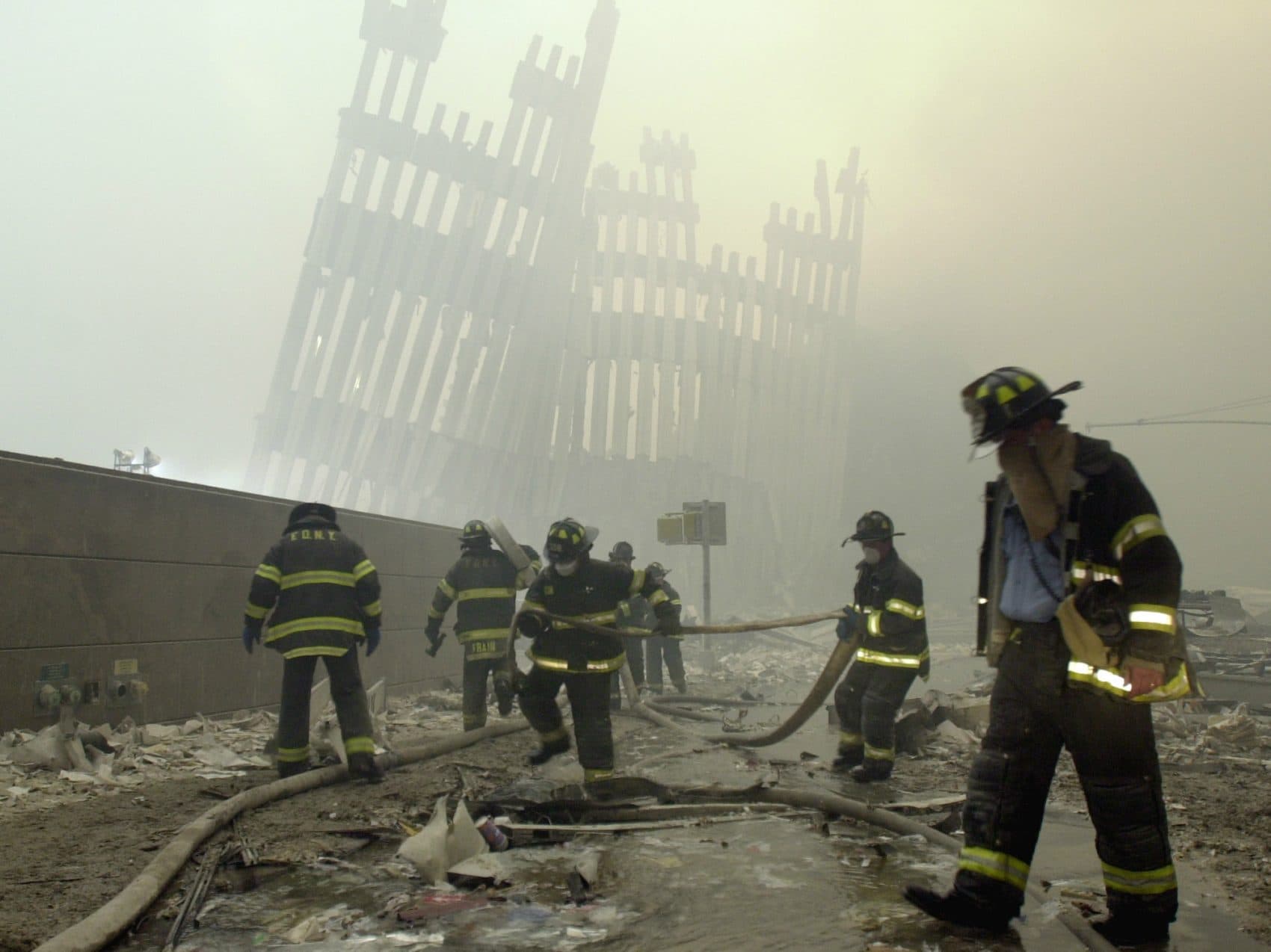 After 9/11, two years and 23 suicide attacks in Israel left author Alison Murphy inured to the frequency of terror strikes. Now she wonders, can she get unused to such them? Pictured: Firefighters work beneath the destroyed mullions, the vertical struts which once faced the soaring outer walls of the World Trade Center towers, after a terrorist attack on the twin towers in New York on September 11, 2001. (Mark Lennihan/AP)