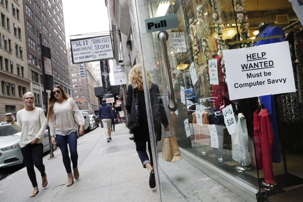 A "help wanted" sign hangs in a store window in New York on Thursday, Oct. 1, 2015. (Mark Lennihan/AP)