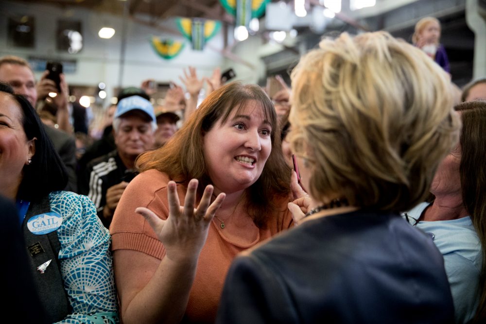 Democratic presidential candidate Hillary Clinton speaks with a woman in the audience during a rally at the Colorado State Fairgrounds in Pueblo, Colo., Oct. 12, 2016. (Andrew Harnik/AP)