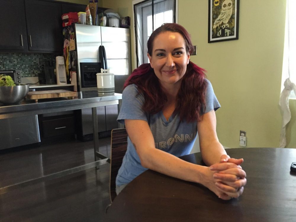 Sarah Dickson, a graphic designer in Scottsdale, is one of the many consumers who will have to switch policies this year in Arizona. (Will Stone/KJZZ)