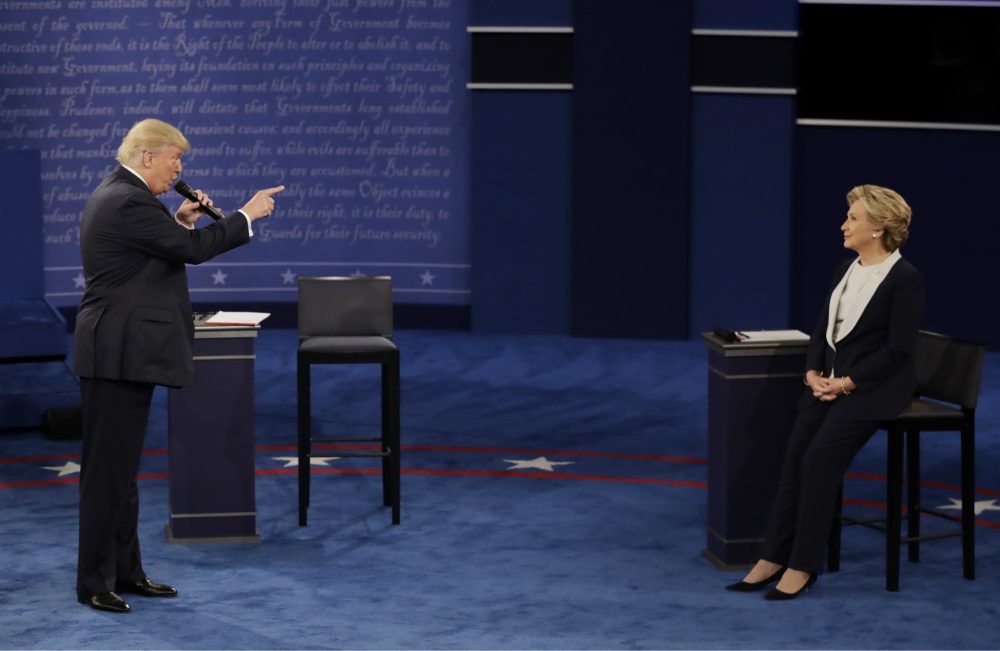 Trump’s performance on Sunday night was the single most depressing political event of my lifetime, writes Steve Almond. By the end of it, I wasn’t angry or indignant or even triumphant. I was just incredibly sad.
Pictured: Republican presidential nominee Donald Trump speaks to Democratic presidential nominee Hillary Clinton during the second presidential debate at Washington University in St. Louis, Sunday, Oct. 9, 2016. (Patrick Semansky/AP)