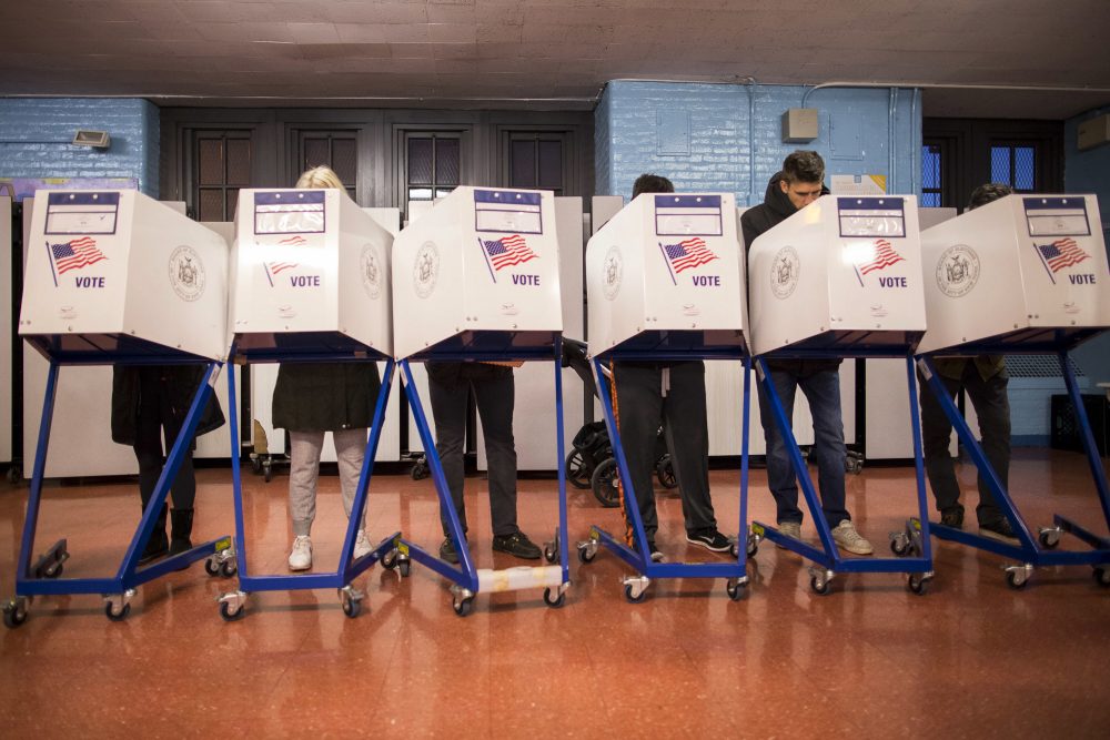 Voters fill out their forms at a polling station in the Brooklyn borough of New York, Tuesday, Nov. 8, 2016. (Alexander F. Yuan/AP)