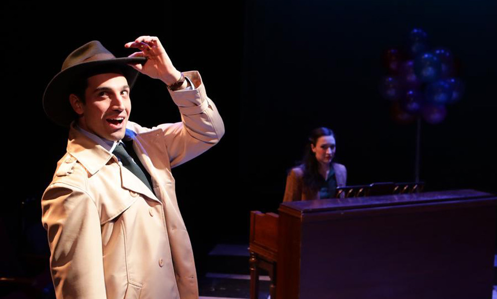 Jared Troilo as the young officer, Marcus, and Kristen Salpini, as a suspect, in "Murder for Two" at the Lyric Stage. (Courtesy Mark S. Howard/Lyric Stage)