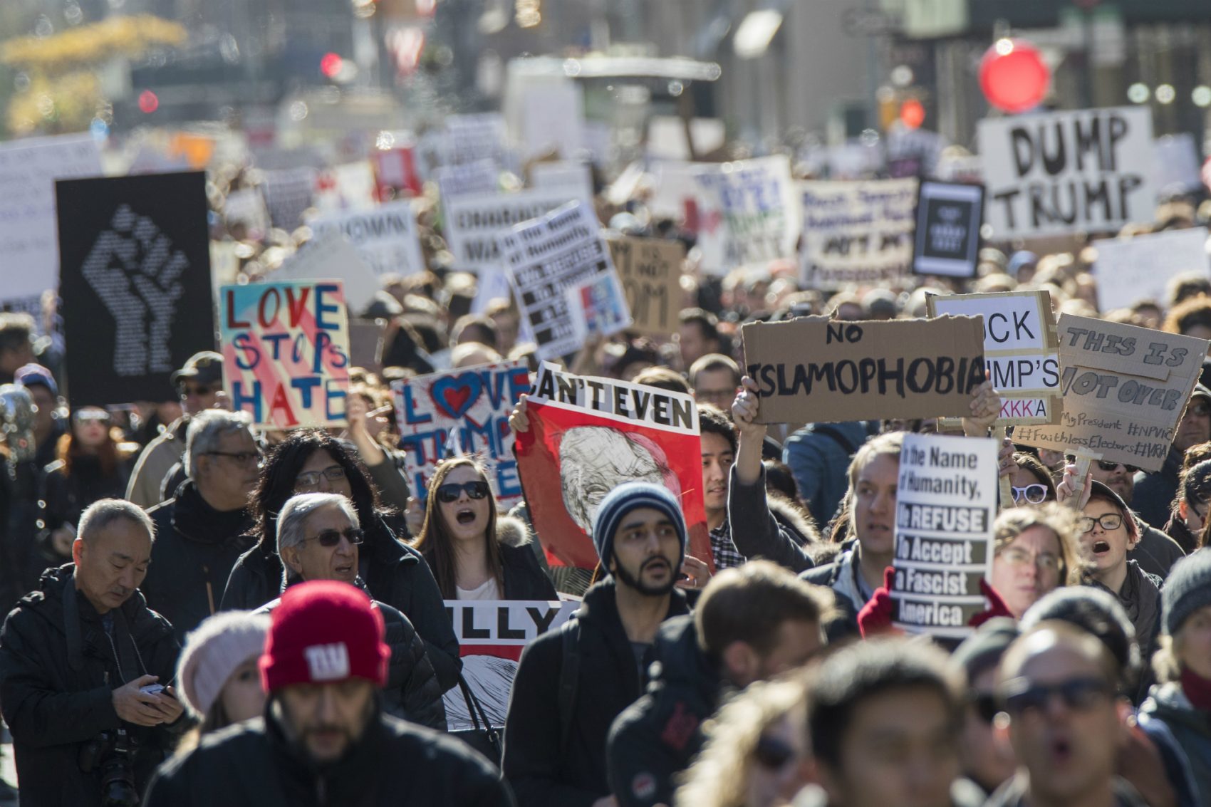 If we want President Trump to reckon with the human toll of his rhetoric and his most dangerous proposals, writes Steve Almond, we have to confront him with our humanity.
Pictured: Demonstrators march up 5th Avenue during a protest against the election of President-elect Donald Trump, Saturday, Nov. 12, 2016, in New York. (Mary Altaffer/AP)