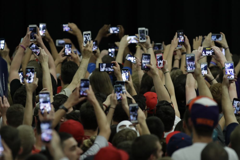 The failure of most pollsters to accurately predict the election outcome demonstrates a failure to embrace complexity, writes Julie Wittes Schlack, and that’s risky not just for professional researchers, but for all of society. Pictured: Audience members stretch for photos of Donald Trump before a campaign rally at West Chester University on April 25, 2016, in West Chester, Pa. (Matt Slocum/AP)