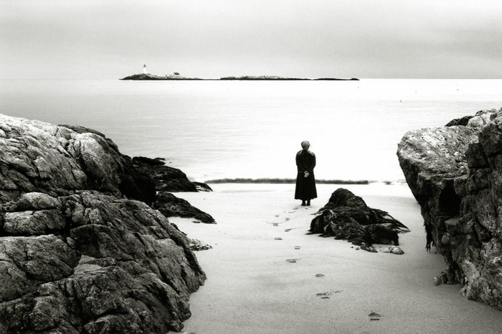Alexandra de Steiguer looks out from Star Island toward the White Island Lighthouse. (Courtesy of de Steiguer)