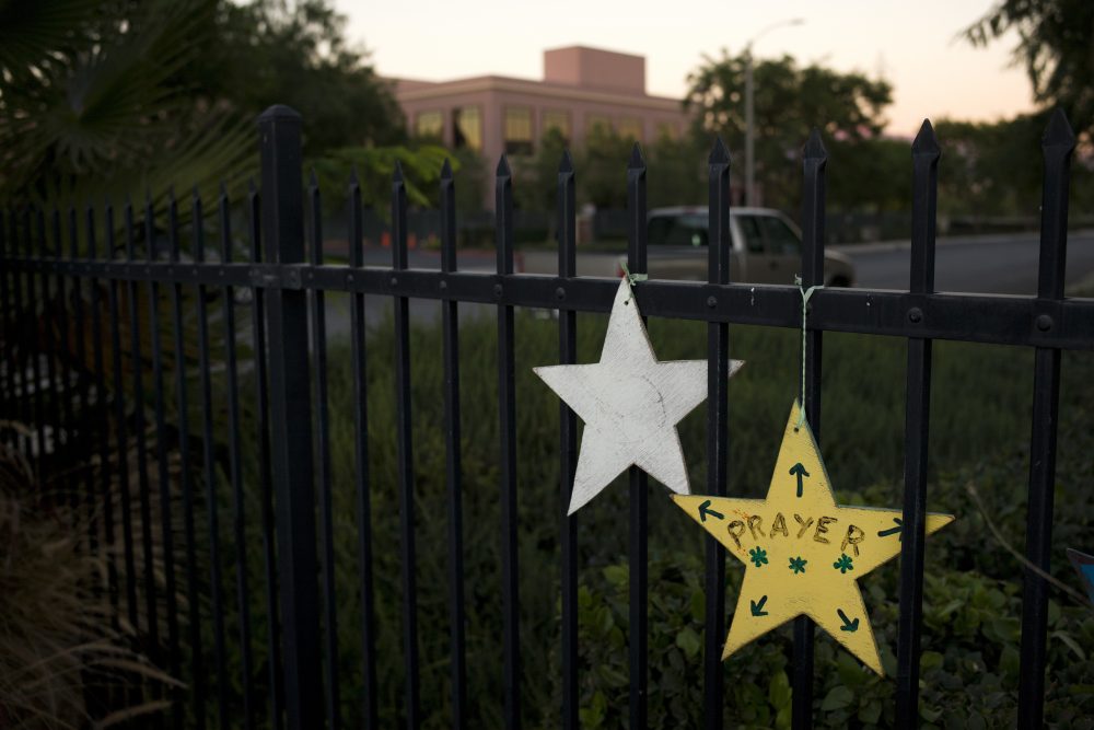 In this Nov. 18, 2016 photo, the Inland Regional Center building where the Dec. 2, 2015, terror attack took place is visible in the background behind star-shaped memorial pieces in San Bernardino, Calif. (Jae C. Hong/AP)