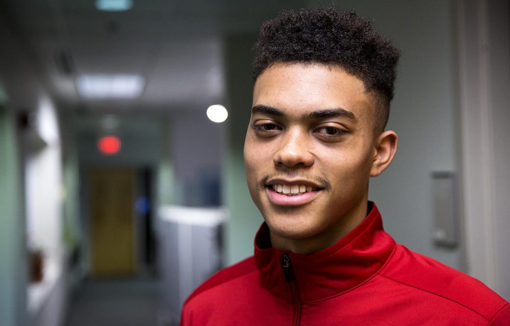 Isaiah Robinson, his parents and five siblings lost their home in Cambridge in a 10-alarm fire over the weekend. He's one of 11 Cambridge Rindge and Latin students who lost their homes in the fire that displaced more than 100 people and damaged at least 16 buildings. (Robin Lubbock/WBUR)