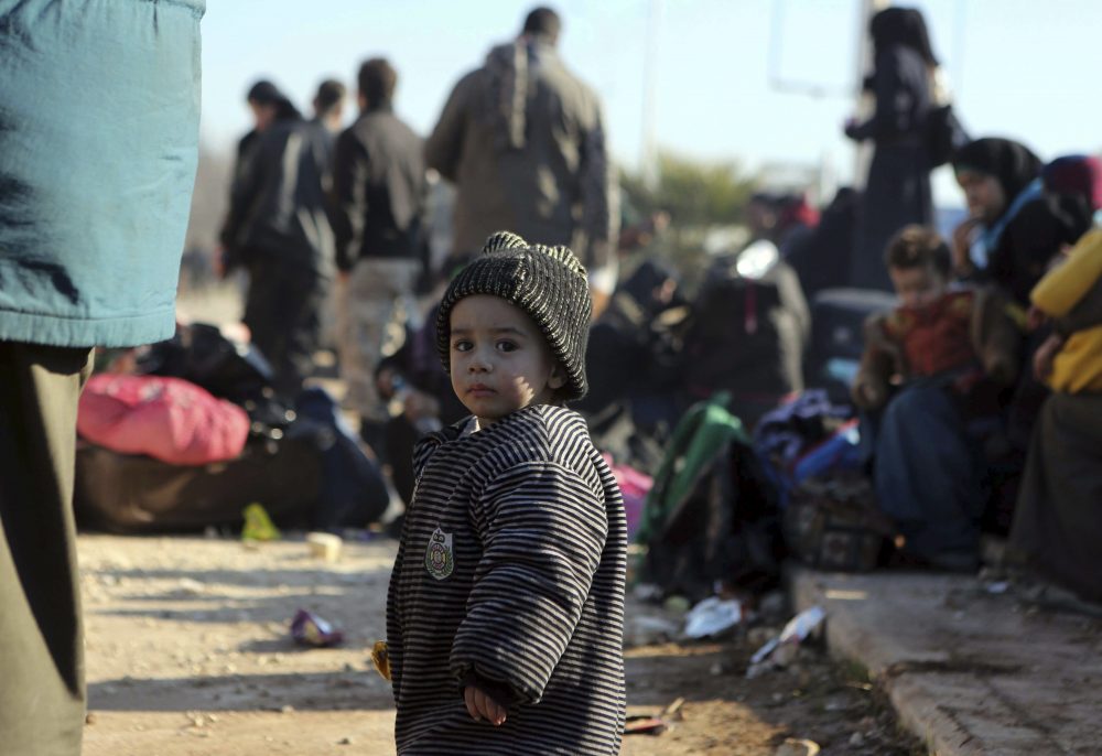 A young Syrian child evacuated from the embattled Syrian city of Aleppo during the ceasefire arrives at a refugee camp in Rashidin, near Idlib, Syria, early Monday, Dec. 19, 2016. The Security Council on Monday approved the deployment of U.N. monitors to the Syrian city of Aleppo as the evacuation of fighters and civilians from the last remaining opposition stronghold resumed after days of delays. (AP)