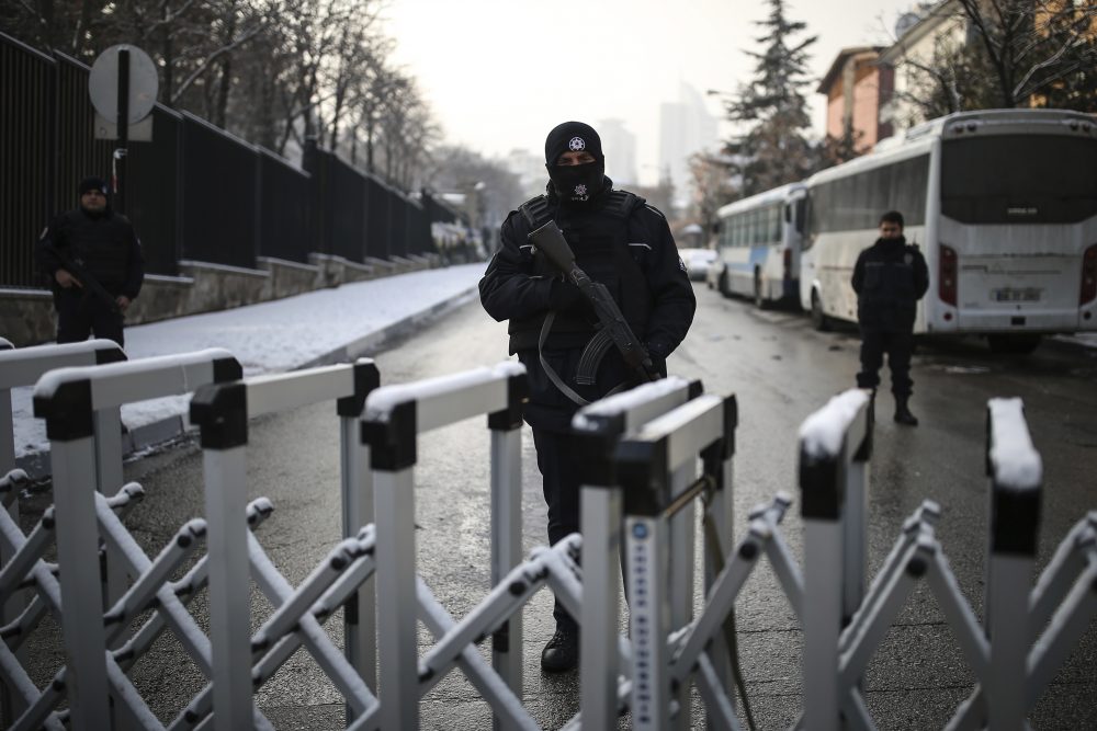 A Turkish police officer secures the road leading to the Russian embassy in Ankara, Turkey, Wednesday, Dec, 21, 2016. Russian Ambassador to Turkey, Andrei Karlov, was assassinated Monday by a police officer during the opening of a photo exhibition. (Emrah Gurel/AP)
