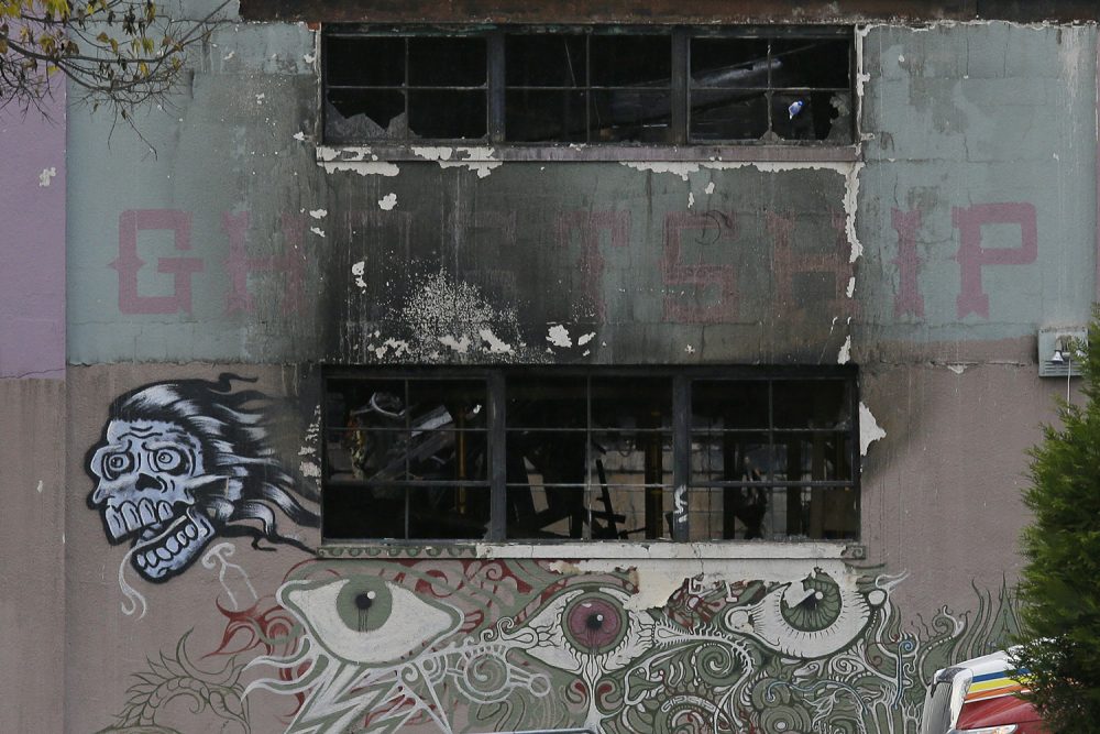The front of The Ghost Ship warehouse damaged from a deadly fire is seen Wednesday, Dec. 7, 2016, in Oakland, Calif. (Eric Risberg/AP)