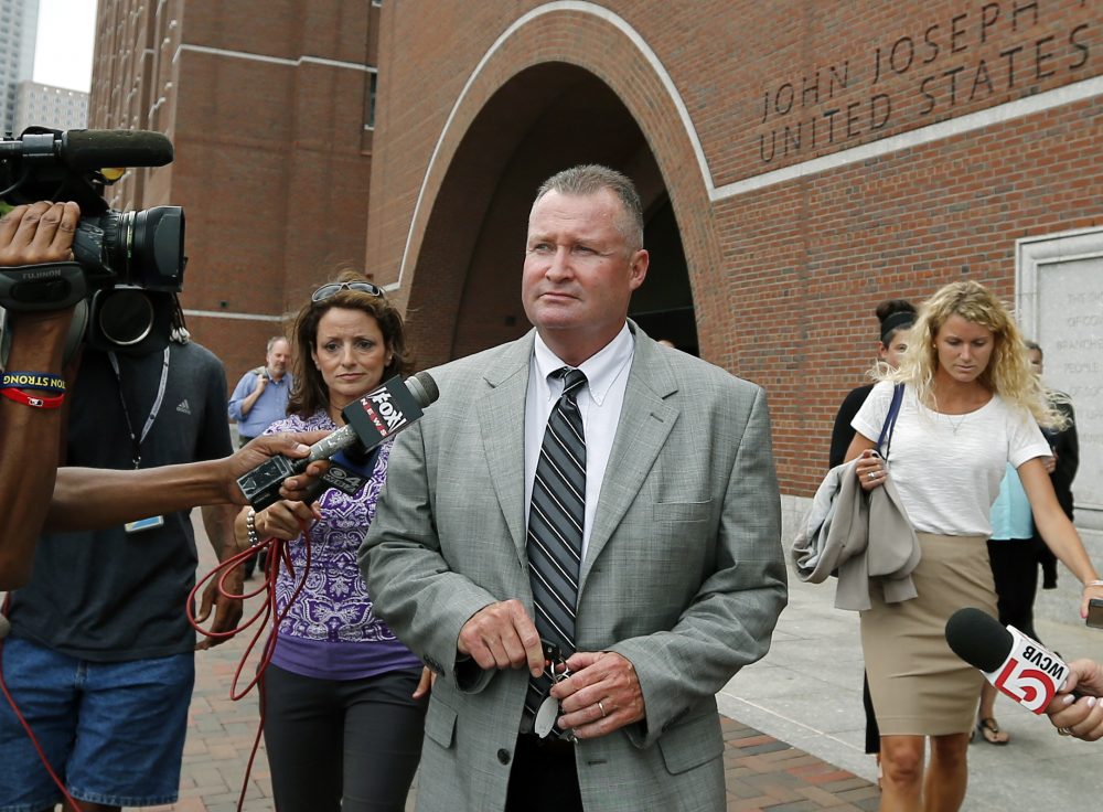 Former Massachusetts state probation commissioner John O'Brien leaves federal court in Boston in 2014 where closing arguments were completed in his trial. (Elise Amendola/AP)