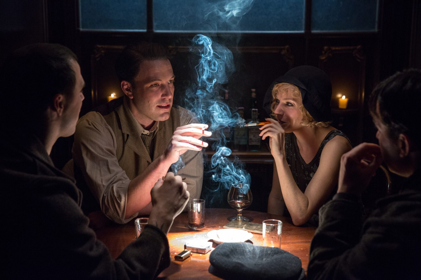 Ben Affleck, as Joe Coughlin, and Sienna Miller, as Emma Gould, in "Live By Night." (Courtesy Warner Bros. Pictures)