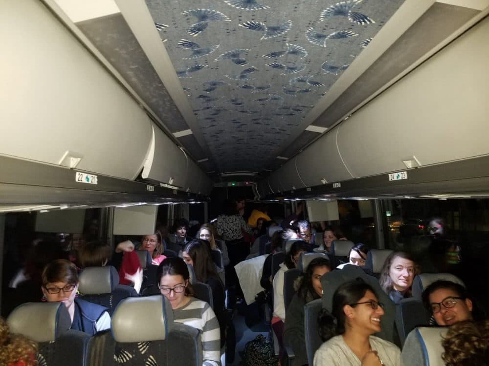 More than 50 people -- mostly women and Harvard graduate students -- drove through the night on a chartered bus from Cambridge to D.C. for Saturday's Women's March on Washington. (Zeninjor Enwemeka/WBUR)