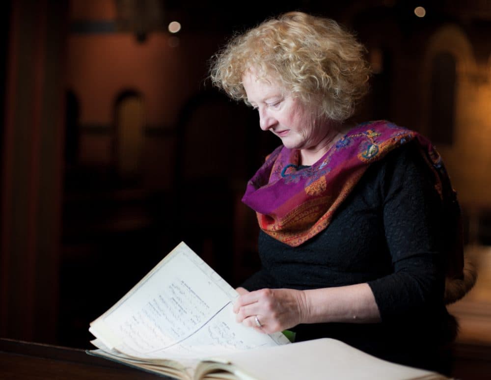 Boston Camerata's artistic director Anne Azéma pores over a manuscript of "Play of Daniel." (Courtesy Kristin Otharsson)