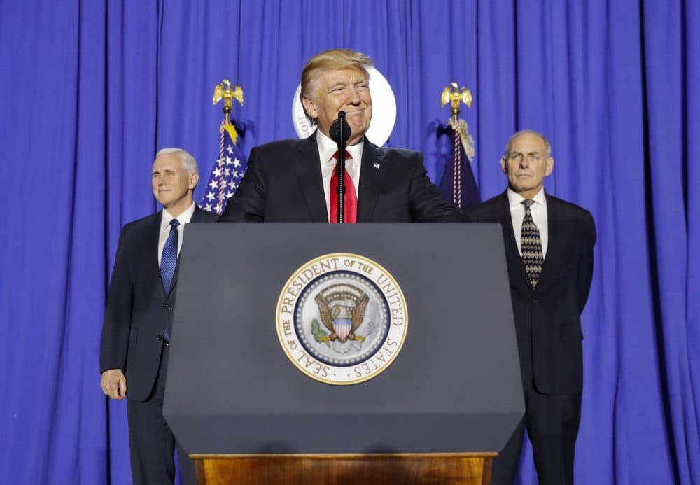 President Donald Trump, accompanied by Vice President Mike Pence, left, and Homeland Security Secretary John F. Kelly, pauses while speaking at the Homeland Security Department in Washington, Wednesday, Jan. 25, 2017. (Pablo Martinez Monsivais/AP)