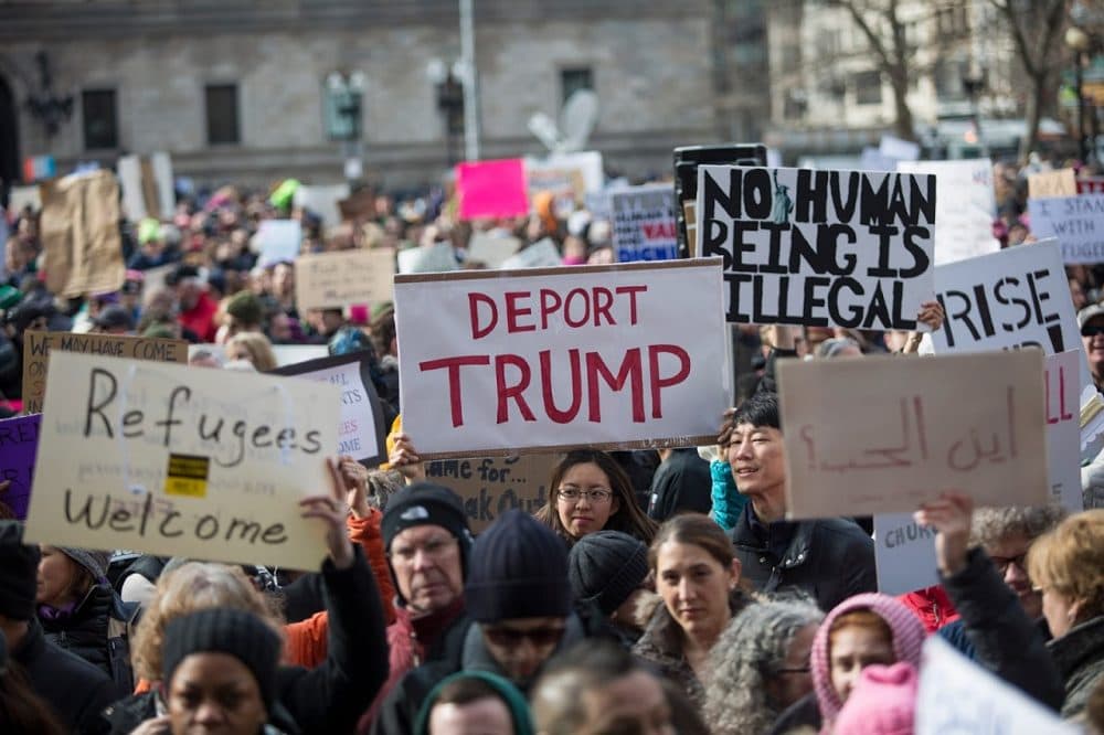 On Sunday, Copley Square was awash with signs protesting the executive order given by Donald Trump to temporarily halt immigration from seven majority-Muslim countries. (Jesse Costa/WBUR)