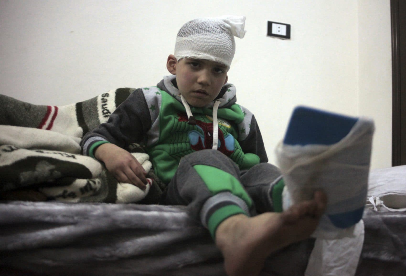 Their voices must be represented, writes Rafael Castro. Their stories must be told. We must commit ourselves as a society to care about their welfare as our own. Pictured: A Syrian child, evacuated from Aleppo, sits in a field hospital bed near Idlib, Syria, Friday, Dec. 16, 2016. (AP)