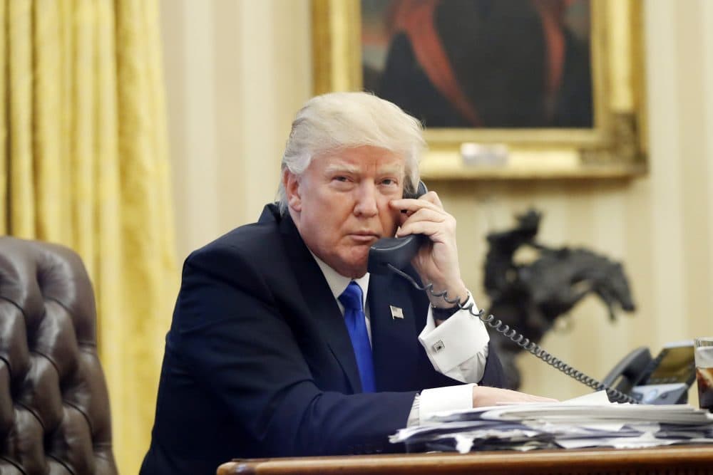 President Donald Trump speaks on the phone with Prime Minister of Australia Malcolm Turnbull in the Oval Office of the White House in Washington on Jan. 28, 2017. (Alex Brandon/AP)