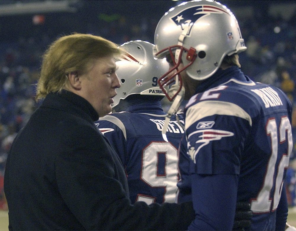 Donald Trump, left, stops to talk to New England Patriots quarterback Tom Brady prior to the start of the game at Gillette Stadium, Saturday, Jan. 10, 2004, in Foxborough, Mass. (Elise Amendola/AP)