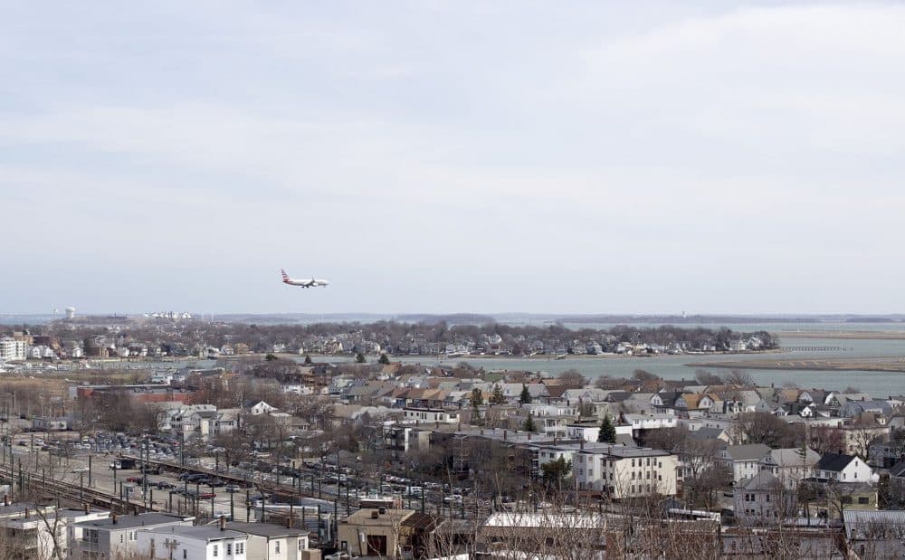 A plane lands at Logan Airport. (Joe Difazio for WBUR)