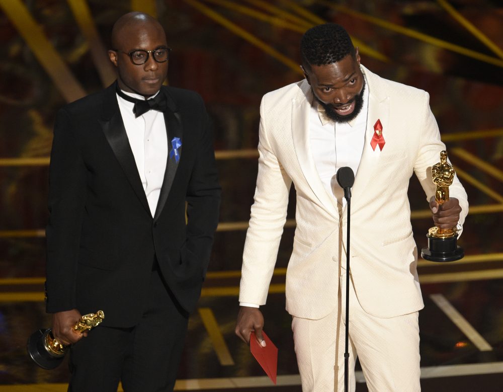 In the 87-year history of the Academy Awards, only four black writers have won Oscars for screenplays, writes John Vercher. Pictured: Barry Jenkins, left, and Tarell Alvin McCraney accept the award for best adapted screenplay for "Moonlight" at the Oscars on Sunday, Feb. 26, 2017, at the Dolby Theatre in Los Angeles. (Chris Pizzello/Invision/AP)