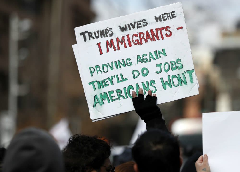 For the 74 percent of registered voters who voted for someone else, or who didn’t vote at all, writes Steve Almond, Trump has been a walking anxiety attack. Pictured: A protester holds a sign during a Day Without Immigrants protest, Thursday, Feb. 16, 2017, in Washington. (Alex Brandon/AP)