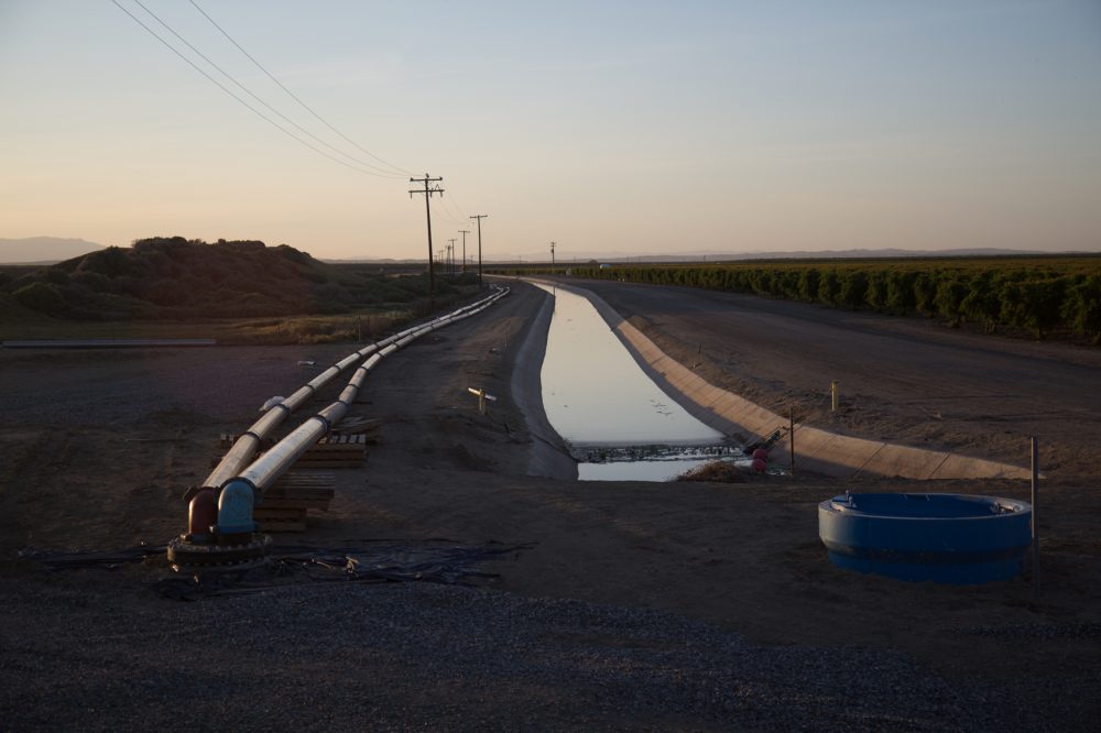 A still image from the documentary "Water and Power," showing a pipeline allegedly owned by Stewart Resnick, bringing water from Dudley Ridge to Lost Hills. (Courtesy Ted Gesing/National Geographic)