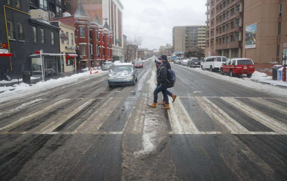 Pedestrians use the crosswalk at U Street in lighter then normal traffic in Washington in March 2017. (Pablo Martinez Monsivais/AP)