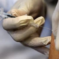 In this Sept. 17, 2015, file photo, a nurse administers a flu vaccine shot in Washington. (Jacquelyn Martin/AP)