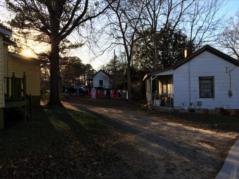 The sun sets on the Rose Hill neighborhood of Porterdale, Georgia. These homes were built in the early 20th century for African-American workers at the nearby cotton mill.
(Sam Whitehead/GPB)
