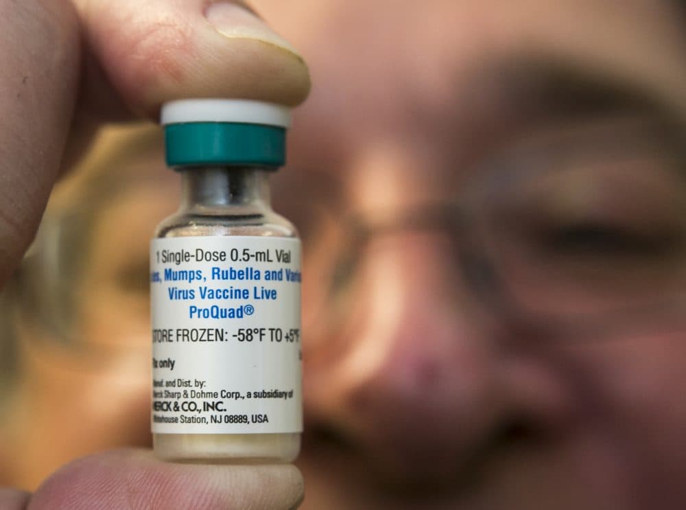 In this 2015 file photo, a pediatrician holds a dose of the measles-mumps-rubella (MMR) vaccine at his practice in Northridge, Calif. (Damian Dovarganes/AP)