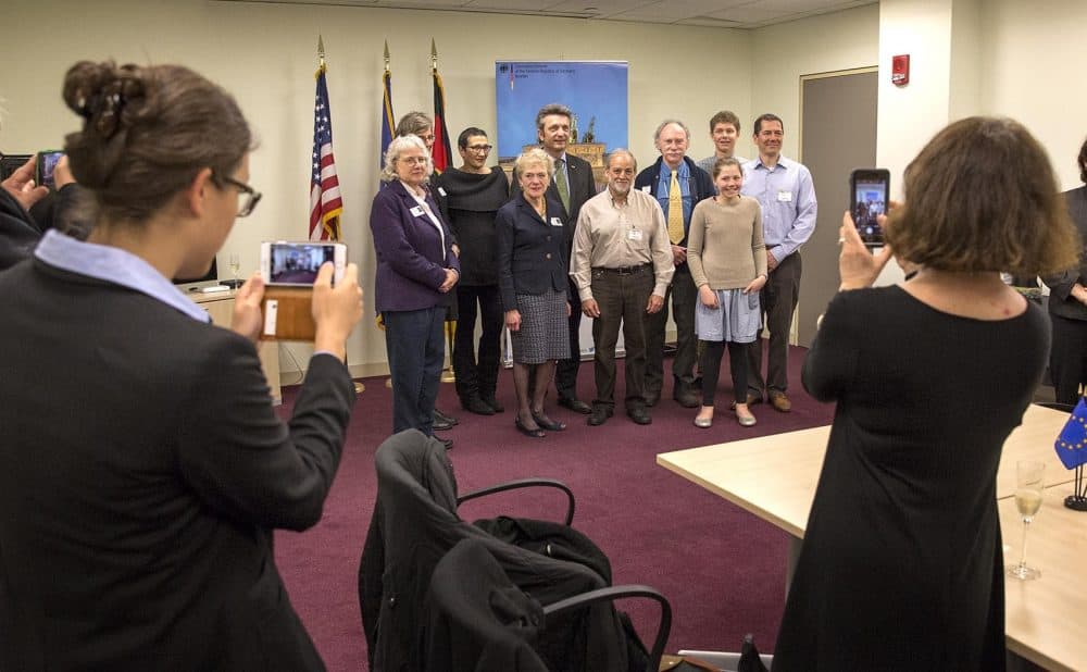 New German citizens pose for a photo with German Consul General Ralf Horlemann at the consulate in Boston. (Robin Lubbock/WBUR)