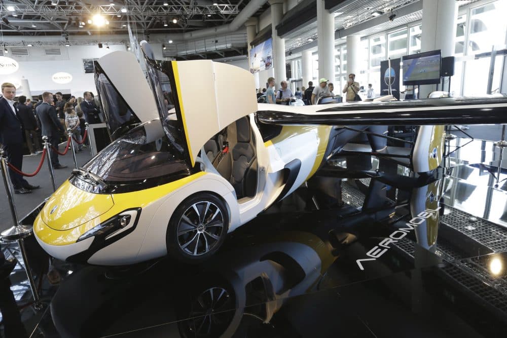 Why does this complicated and ambitious dream endure? asks Tom LeCompte, a pilot -- and a driver. Pictured: The latest version of a flying car called "AeroMobil", a light frame plane with wings that can fold back, like an insect, boosted by a rear propeller, is displayed in Monaco, Thursday, April 20, 2017. The company said that its “AeroMobil is completely integrated aircraft as well as a fully functioning four-wheeled car, powered by hybrid propulsion.” (Claude Paris/AP)