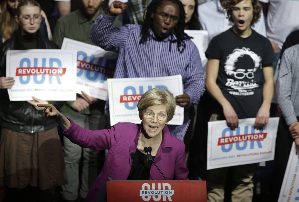 Sen. Elizabeth Warren during a rally in Boston March 31, 2017 with Sen. Bernie Sanders. (Steven Senne/AP)