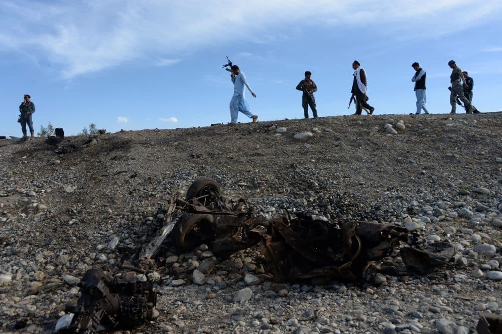 Afghan security forces inspect the site of a suicide attack targeting foreign troops in the Bati Kot district of Nangarhar province on May 1, 2017. (Noorullah Shirzada/AFP/Getty Images)