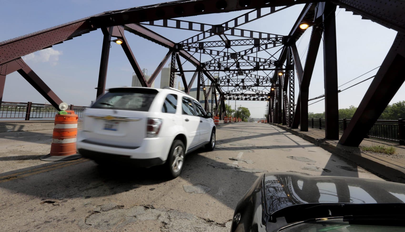 Vehicles drive on the 130th St. bridge over the Little Calumet River in Chicago in 2013. The bridge was classified as both "structurally deficient" and "fracture critical" in federal data for 2012. (M. Spencer Green/AP)